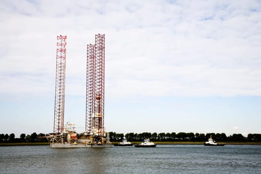 Oil rig is leaving the port of Rotterdam