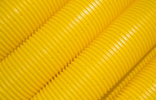 Close up of yellow tubes on a construction site