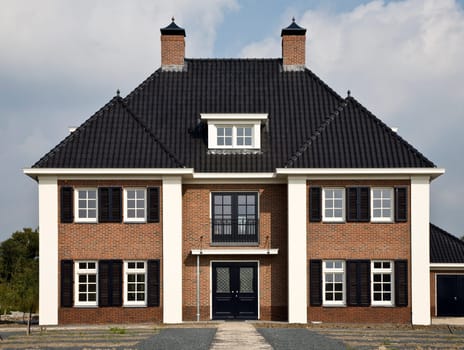 Construction site of a new built house in traditional style