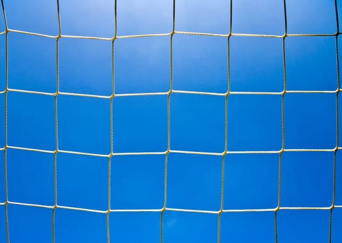 Soccer goal net with a sky background