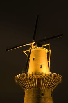 Dutch windmill at night in Schiedam, Holland