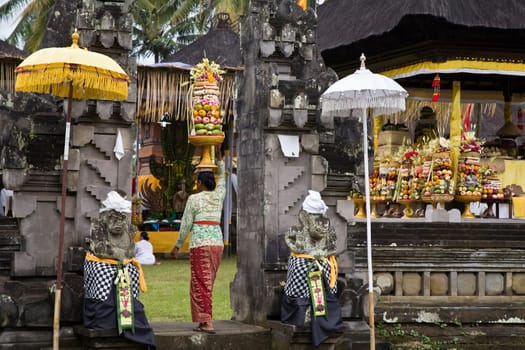 Preparing offerings for a temple ceremony in Bali