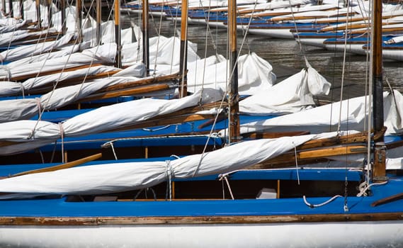 Many blue sailing boats in the marina