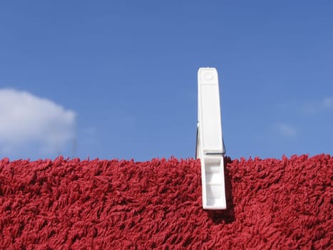 Clothes line against blue sky