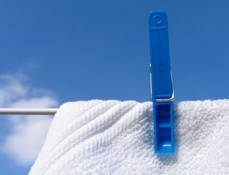 Clothes line against blue sky