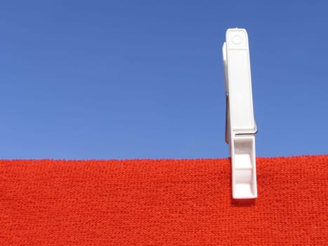 Clothes line against blue sky