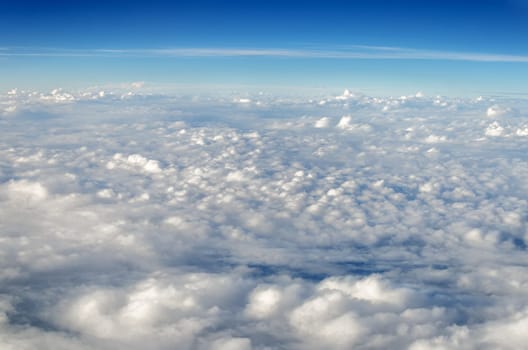 White clouds seen from above set against a blue sky