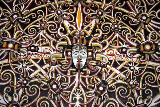 Traditional colorful and woodcarved Indonesian wall