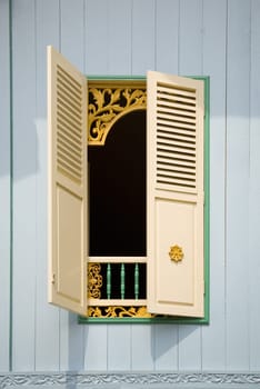 Traditional Indonesian window with open shutter