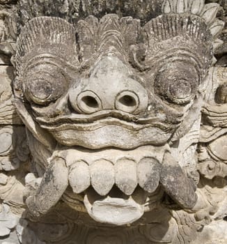 Balinese carved statue guarding a temple