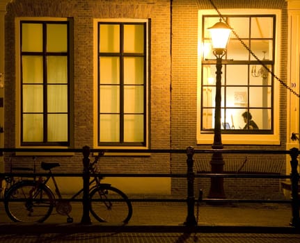 Working at night in an Amsterdam canal house