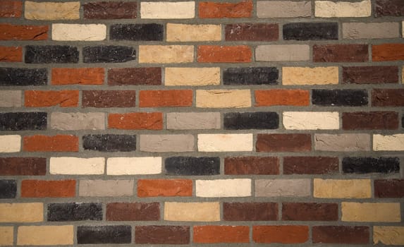 Brick wall background of various colored bricks