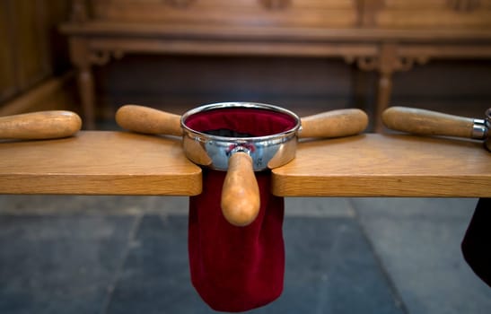 Collector pockets in a Dutch church