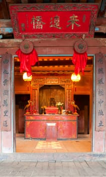 Interior of the Japanese covered bridge with buddhist pagoda attached to one side in Hoi An, Vietnam