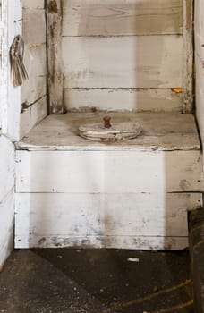 Traditional Dutch toilet in an abandoned farm house in Putten, the Netherlands