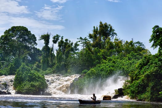 The fisherman under the waterfall