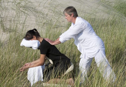 Chair massage in the dunes on the island Ameland, the Netherlands