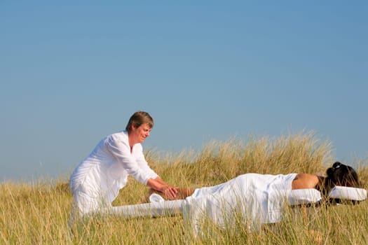 Massage in the dunes on the island Ameland, the Netherlands
