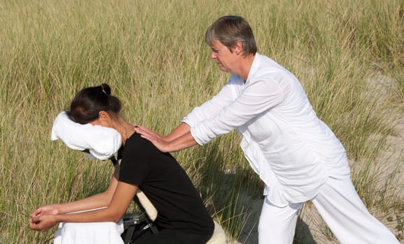 Chair massage in the dunes on the island Ameland, the Netherlands