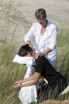 Chair massage in the dunes on the island Ameland, the Netherlands