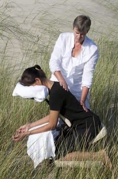 Chair massage in the dunes on the island Ameland, the Netherlands