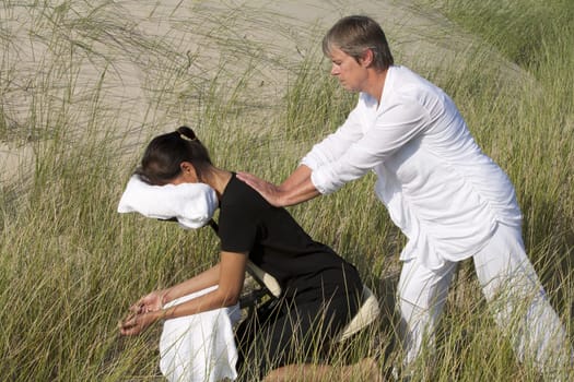 Chair massage in the dunes on the island Ameland, the Netherlands