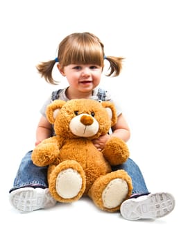adorable toddler girl hugging a teddy bear