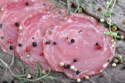Dried sausage on a wooden board (Kindzukas). Traditional sausage in Lithuania.