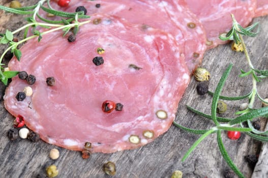 Dried sausage on a wooden board (Kindzukas). Traditional sausage in Lithuania.