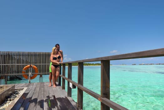 happy young  couple at summer vacation have fun and relax at beautiful sunny  day on beach