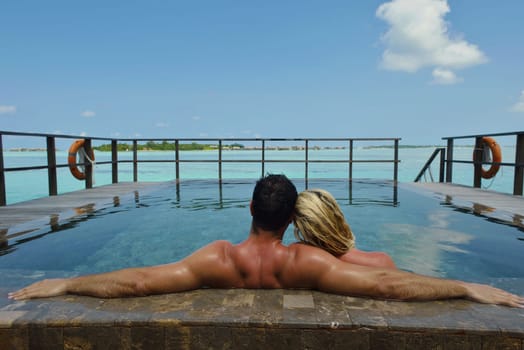 happy young  couple at summer vacation have fun and relax at beautiful sunny  day on beach