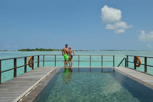 happy young  couple at summer vacation have fun and relax at beautiful sunny  day on beach