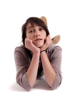 woman lengthened on the ground with hand under her mouth