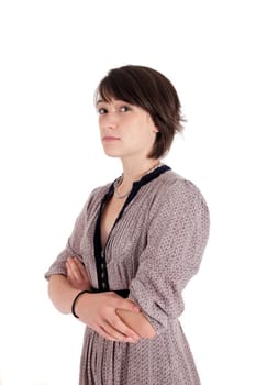 portrait of a young brunette woman arms crossed looking ahead