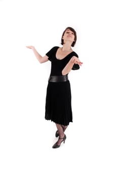 a young woman in strict black dress in studio looking like widow or nanny