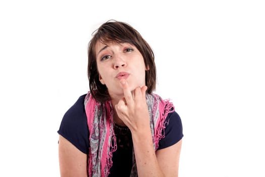 humorous portrait of a young brunette woman with finger of her mouth, colored scarf