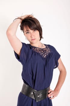 young brunettte woman playing like a model isolated on studio