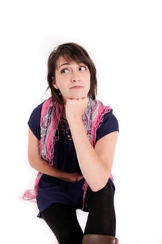 variation portrait of a young brunette woman with colored scraf on studio with her hand under her mounth