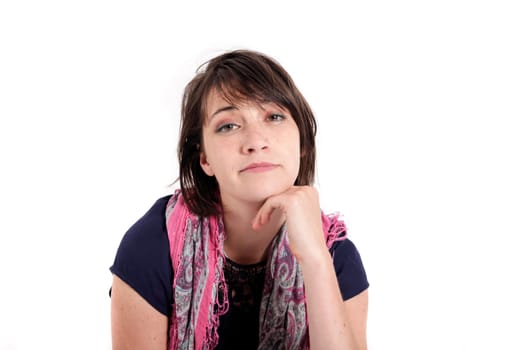 portrait of a young brunette woman with colored scarf looking ahead