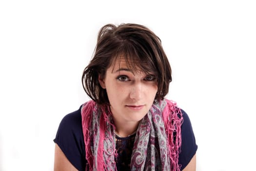 variation of expression on the face of a young brunette woman in studio with a colored scarf