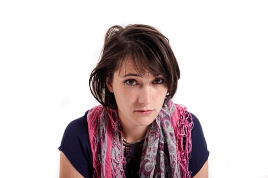 portrait of a young brunette woman with colored scarf looking ahead