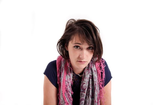 variation of expression on the face of a young brunette woman in studio with a colored scarf