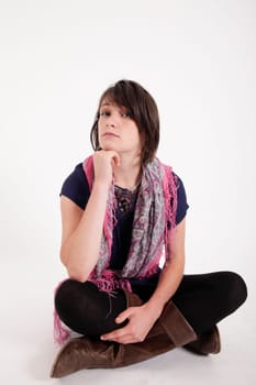 variation of expression on the face of a young brunette woman in studio with a colored scarf