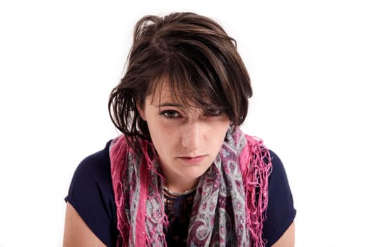 portrait of a young brunette woman with colored scarf looking ahead