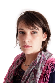 portrait of a young brunette woman with colored scarf looking ahead