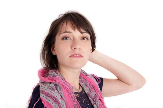 portrait of a young brunette woman with colored scarf looking ahead
