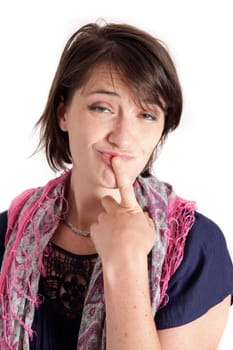 humorous portrait of a young brunette woman with finger of her mouth, colored scarf