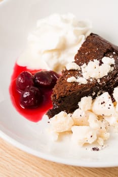 Atrractive dessert from different ingridients on white plate