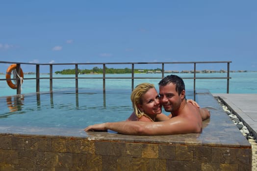 happy young  couple at summer vacation have fun and relax at beautiful sunny  day on beach