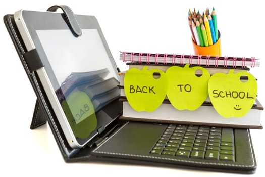 Back to school with digital tablet pc, books and pencils on white background